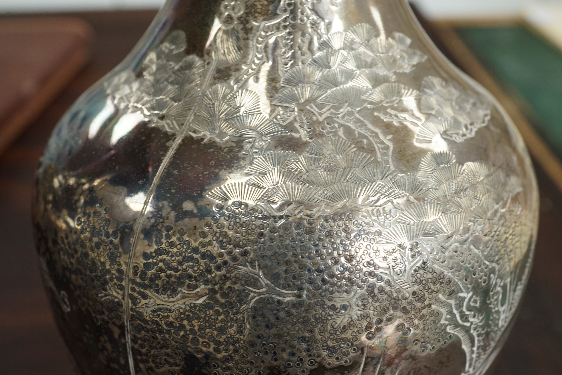 A pair of Chinese silver ‘immortals’ vases, late 19th century